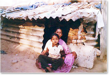 ASCT_Pictures_Mom and Child in front of their home