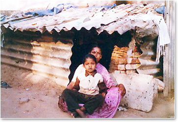 ASCT_Pictures_Mom and Child in front of their home